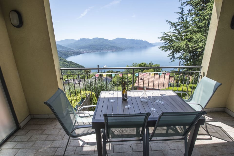 Spacious terrace equipped for enjoying breakfast, lunch, and dinner with a view.