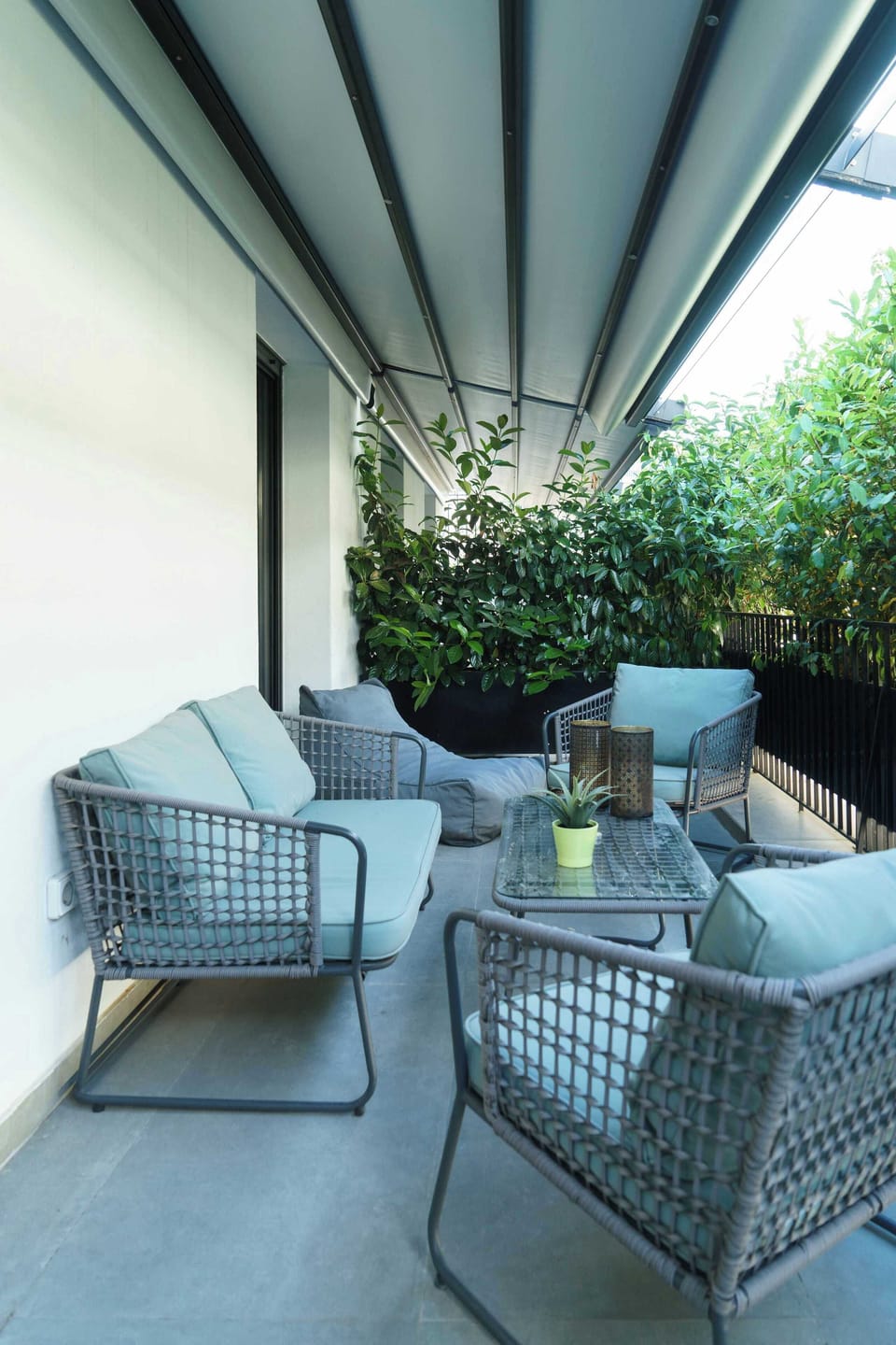 Private balcony retreat with lush greenery views, peaceful setting perfect for morning coffee moments.