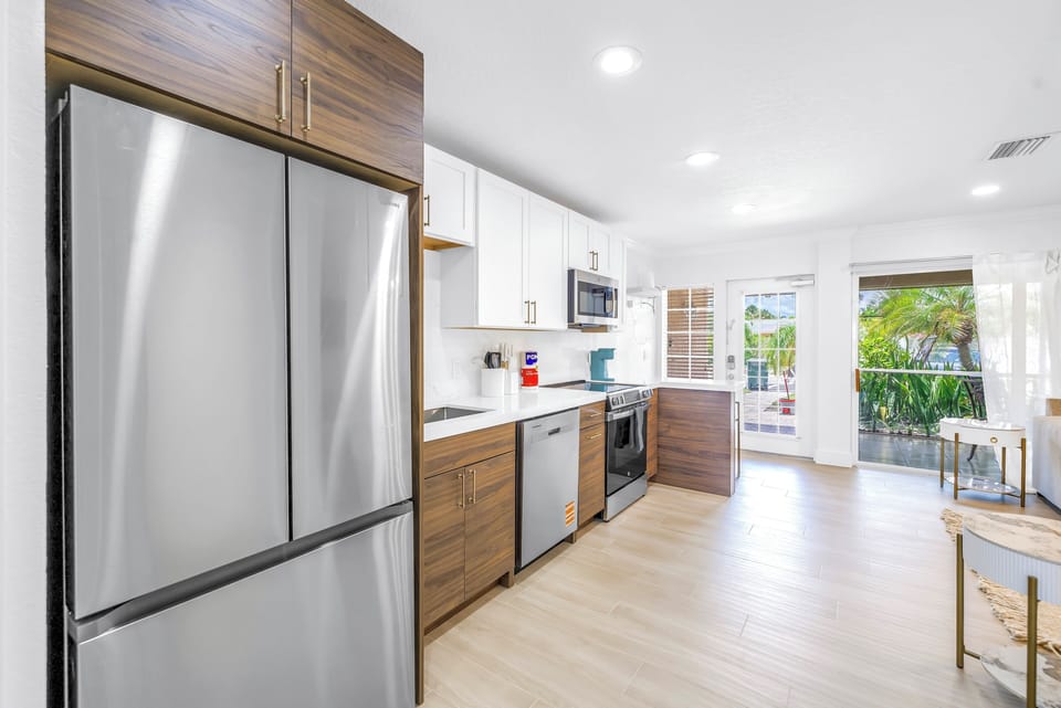 Full-sized fridge with stainless steel appliances.