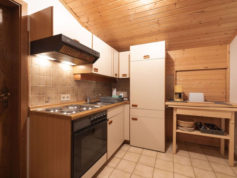 Wood, Kitchen, Interior Design, Cabinetry, Ceiling, Major Appliance, Countertop, Room, Flooring, Floor