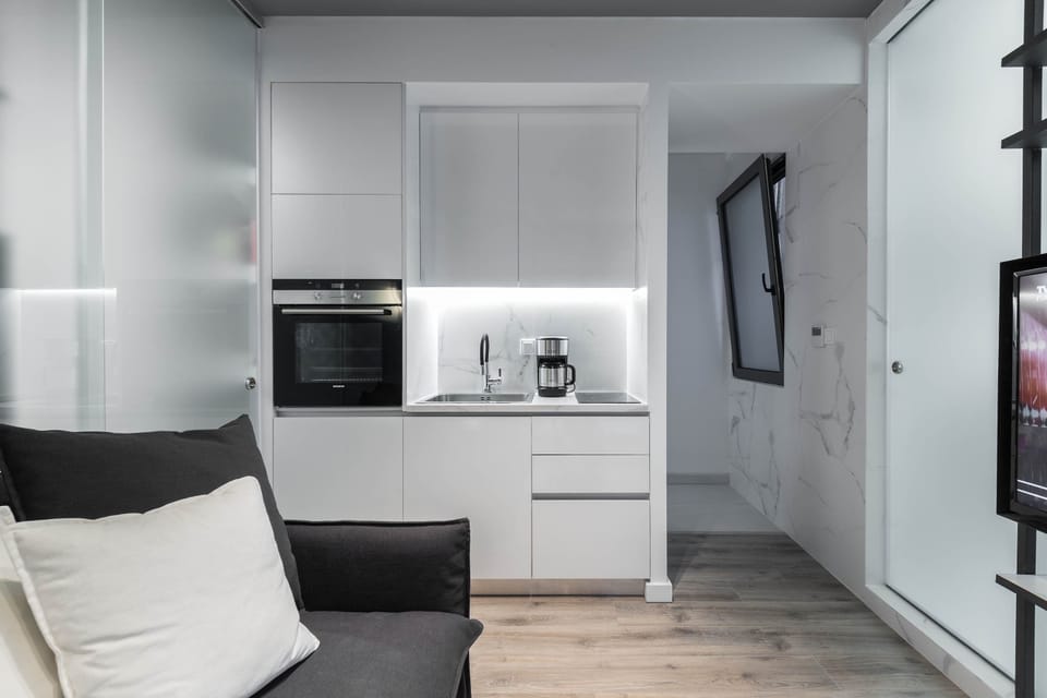 Sleek compact kitchen fully equipped for effortless meals and convenient everyday city living.