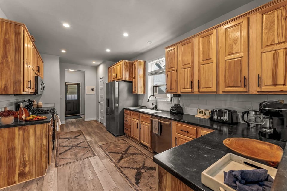【Kitchen】Counter prep space + breakfast bar — 8 guests, one cook, room to move