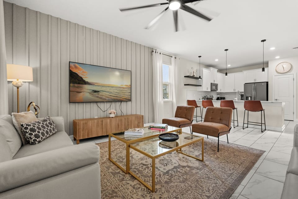 Living Room With Smart TV & Kitchen In Background