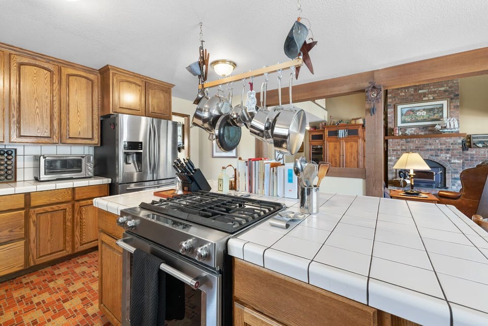 Bright airy kitchen close to the living room and deck and all the fun.