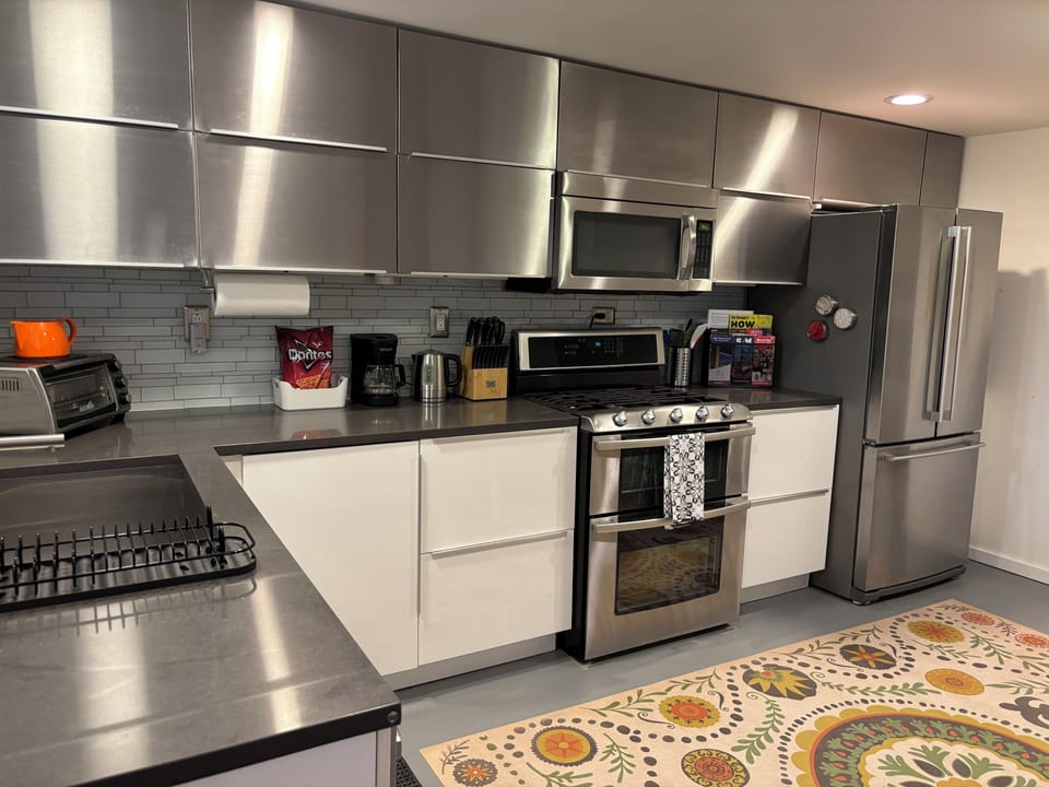 Full kitchen with dishwasher; fully equipped for cooking at home.