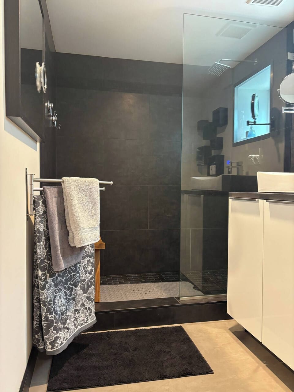 Luxury bathroom with rainfall shower head.