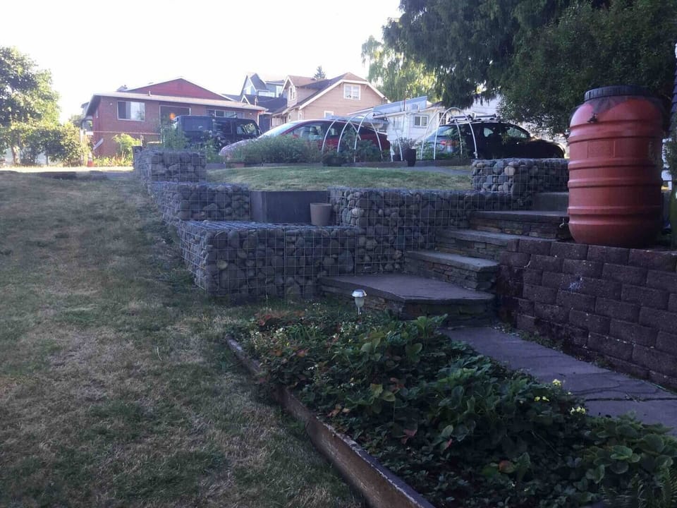 Steps to reach side pathway and backyard private entry.