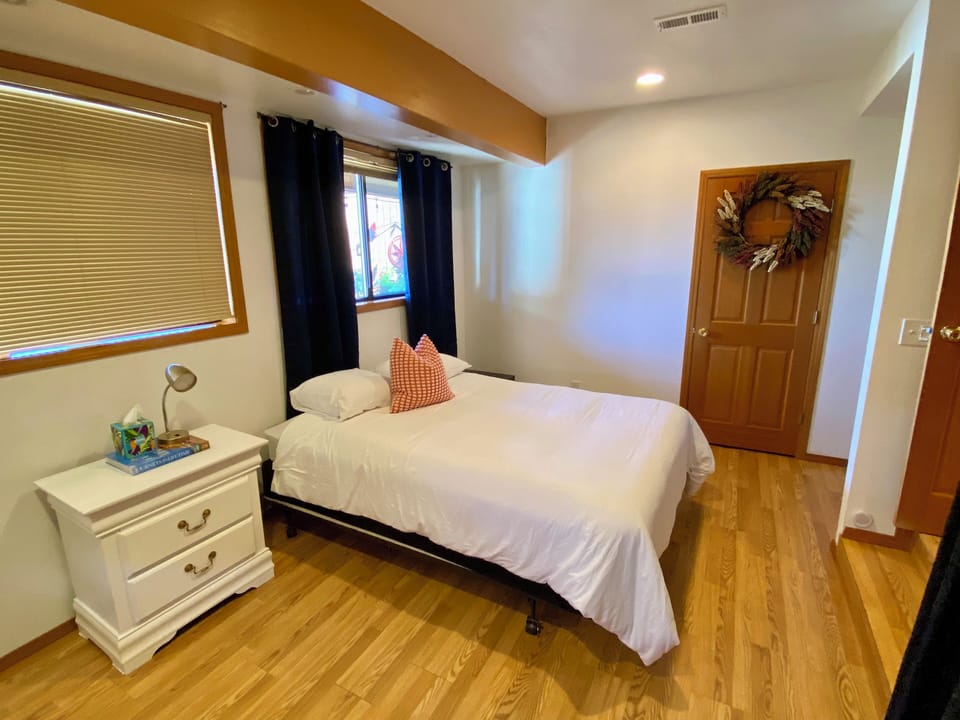 Bedroom #2 with view of garden. W/D are located in this bedroom