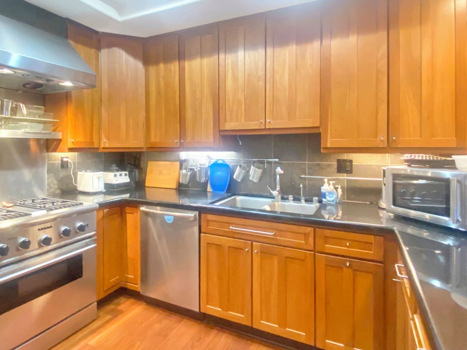 Gorgeous cabinetry, stainless steel appliances wrap around this chef's kitchen