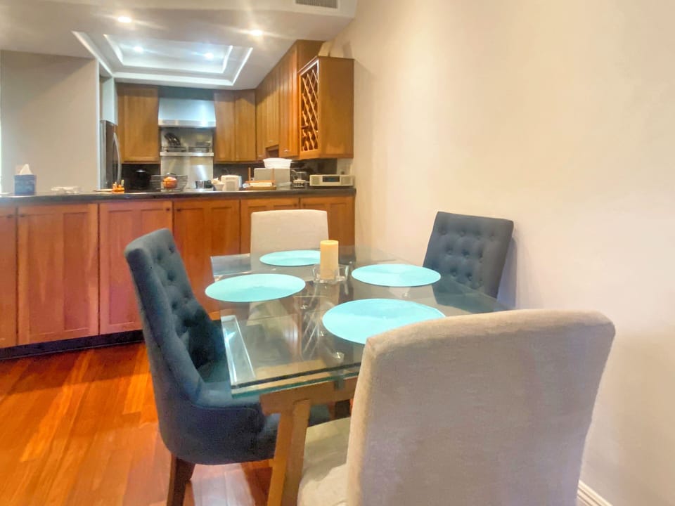 Dining area overlooks expansive kitchen and granite counters