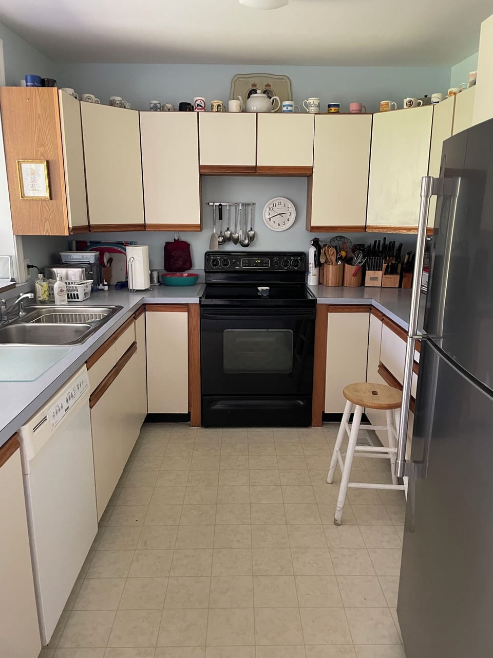 Cozy old-school kitchen renovated with brand new modern fridge and amenities.