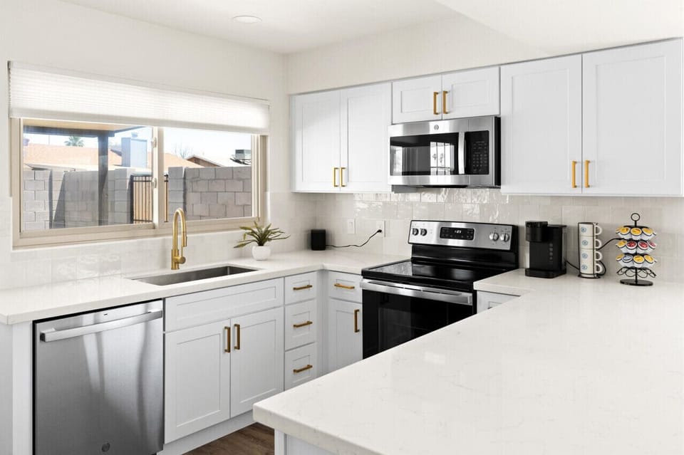 Sleek kitchen with modern appliances and plenty of counter space.