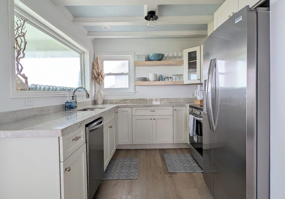 Brand new kitchen with new appliances, countertops, cabinets, and picture window