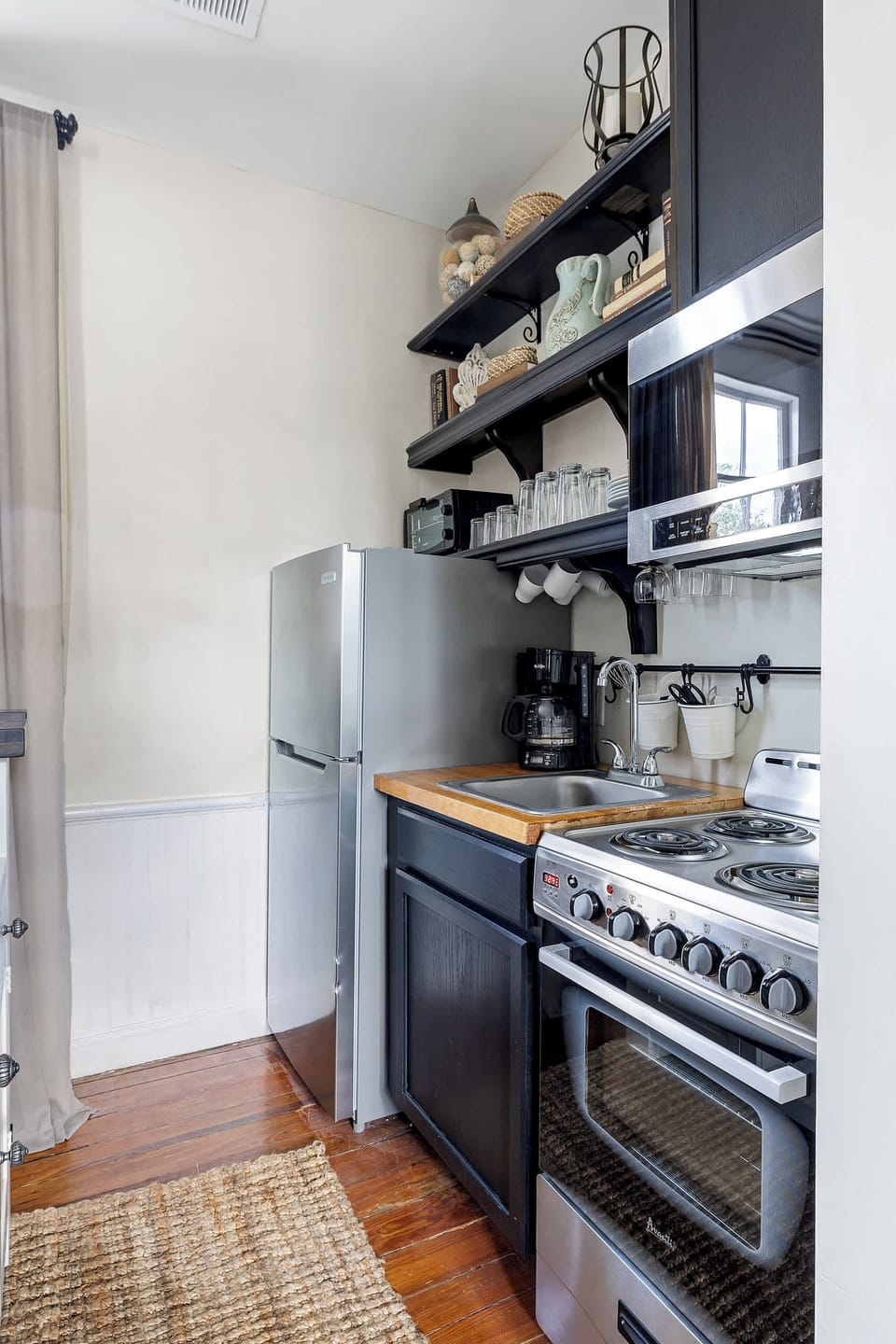 A fully stocked kitchenette with everything you need for a cozy meal or quick snack.