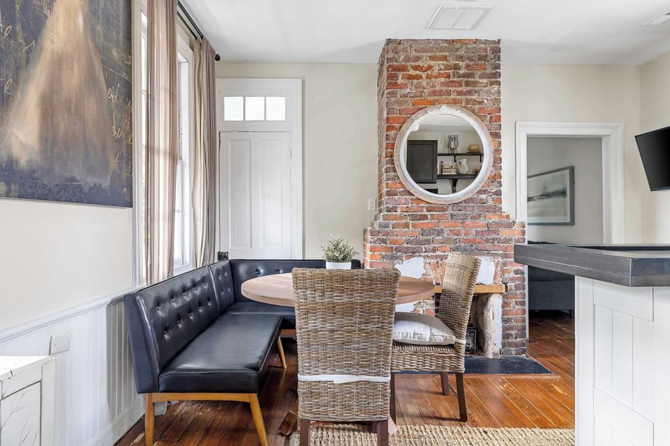 Rustic brick accents and unique wood furniture elevate your stay.