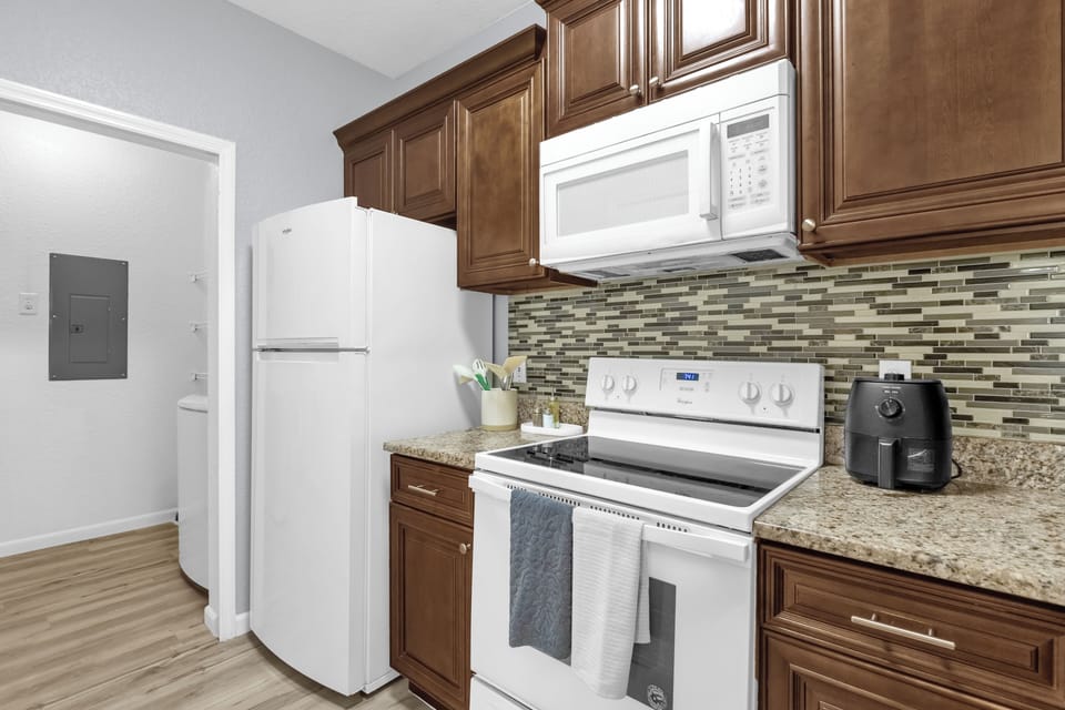 Modern and fully equipped, this kitchen features stainless steel appliances