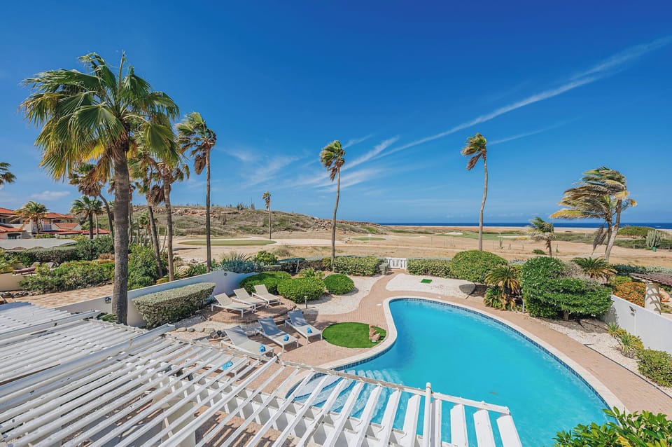 Elevated views over the pool and landscaped gardens below