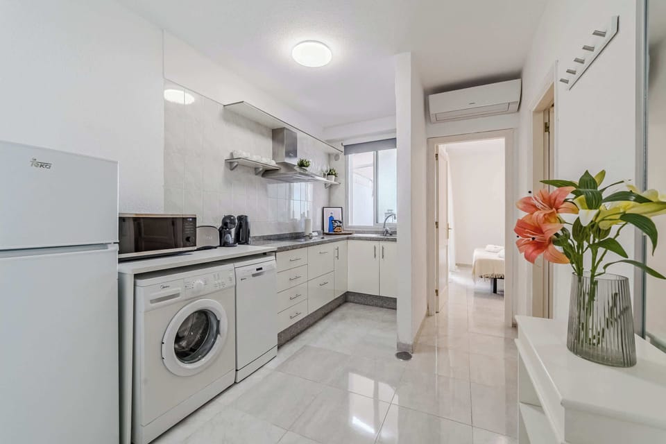 Fully Equipped Kitchen with Fridge, Dishwasher, Washing Machine, Coffee Maker & More. 