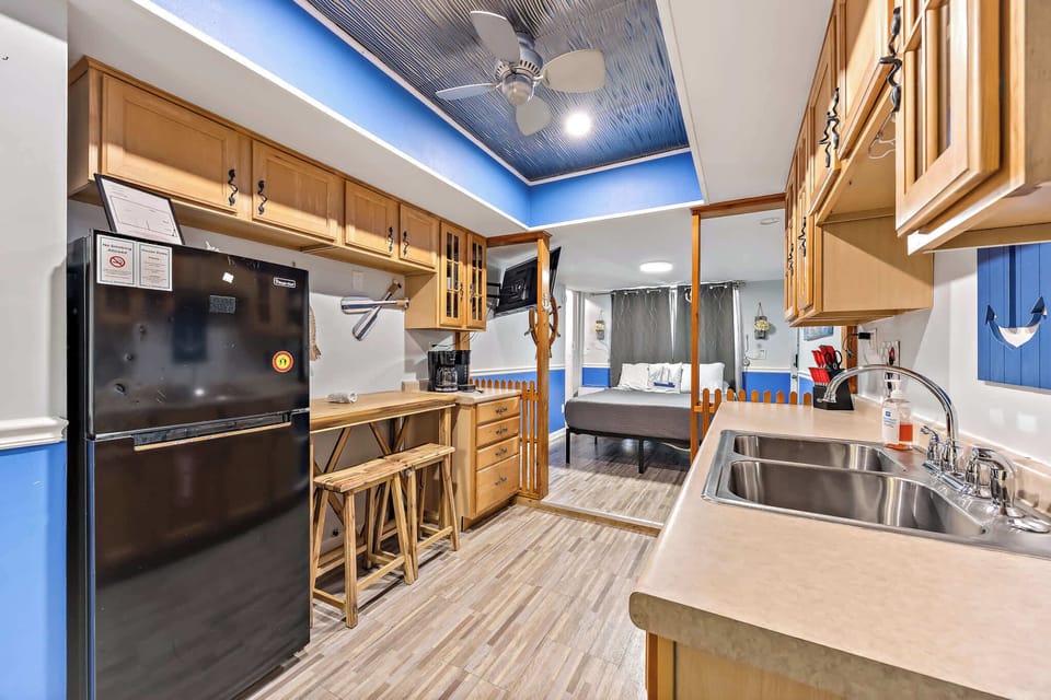 Kitchen 2 - Bright kitchen with wood cabinets and bar
