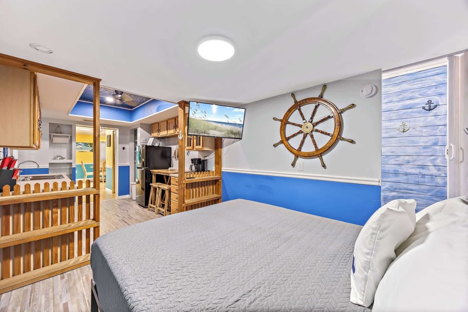 Nautical bedroom with wooden ship wheel decor
