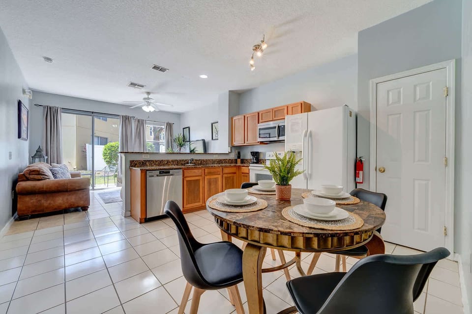 open kitchen and dining area with natural light and garden view