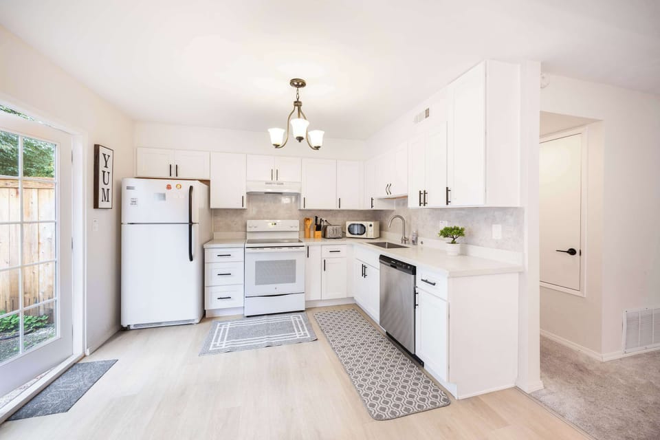 A spacious kitchen area offering a full view of the dining room. 