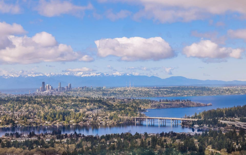This aerial shot showcases breathtaking views of the city skyline, with a mix of urban energy and waterfront beauty.