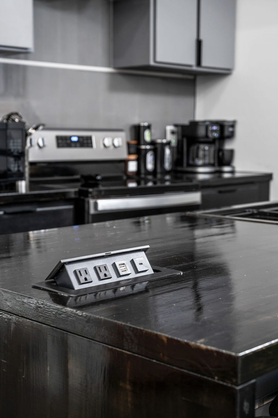 Hidden outlets and USB ports pop up right from the countertop—perfect for charging and powering all your appliances!