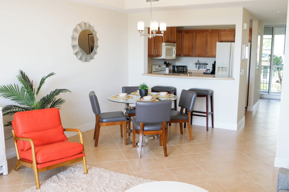 Dining area comfortably seats 4, perfect for family meals or cozy gatherings.