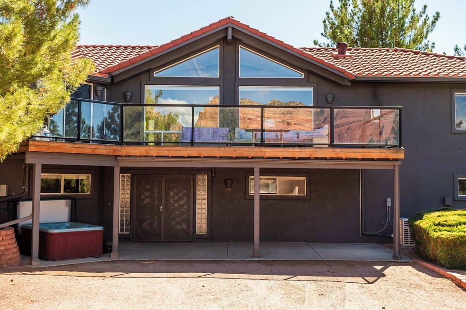 Witness fiery red rocks and sky from your elevated escape.