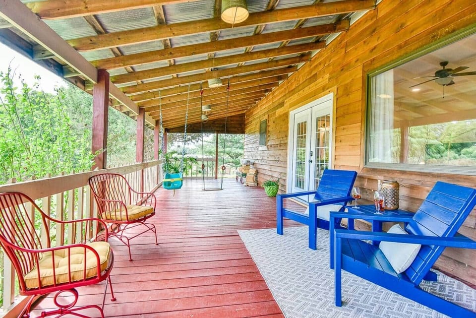 Enjoy the large covered back porch with swings for the kiddos.