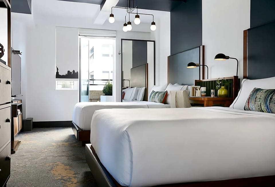 Stretch out on plush beds under warm, designer lighting.