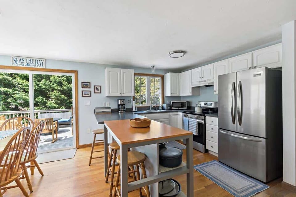 An updated kitchen boasting a kitchen island with bar stool seating