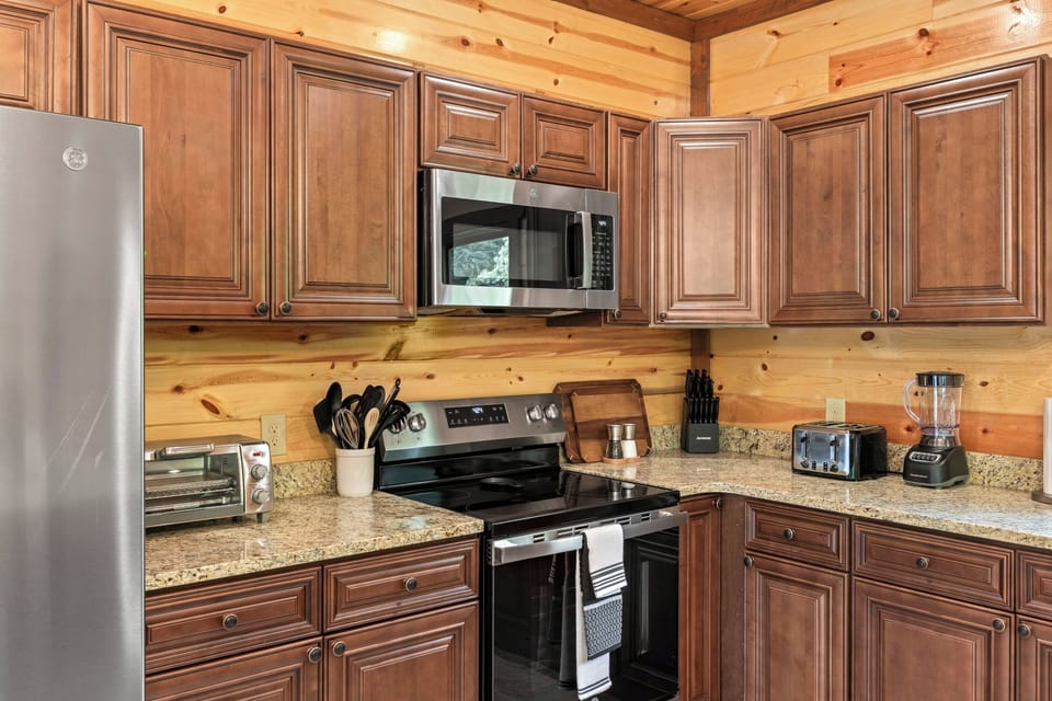 Modern kitchen with stainless steel appliances and all the essentials for home cooked meals.