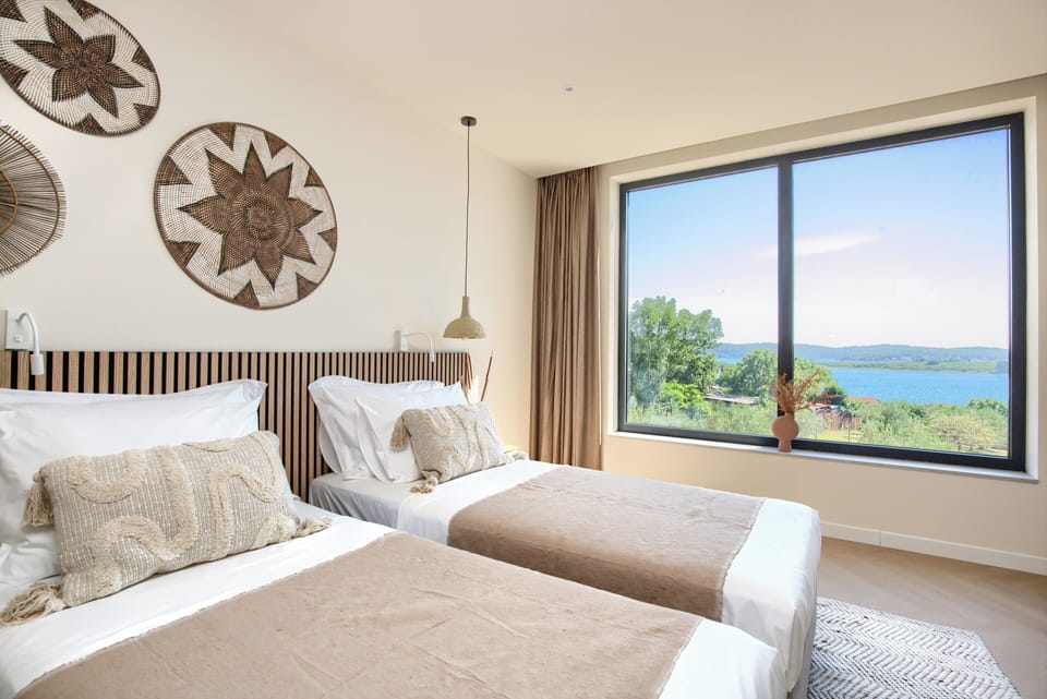 Twin beds w/ sea view, blackout shades + AC — ideal for kids or friends