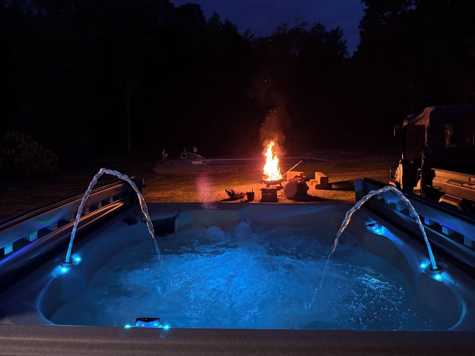 Night view from hot tub - dark skies for stargazing and overlooking fire pit