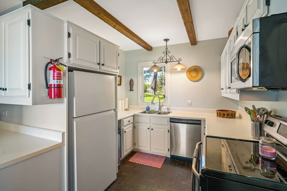 Newly renovated kitchen (2025) with updated appliances and painted cupboards