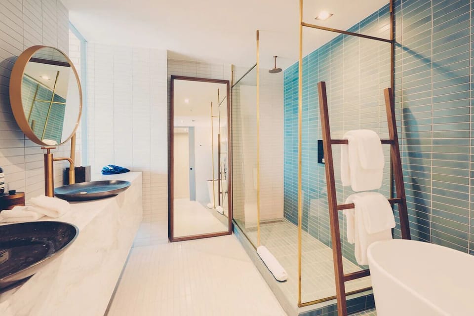 Refresh in a spa-like bath with elegant brass finishes.