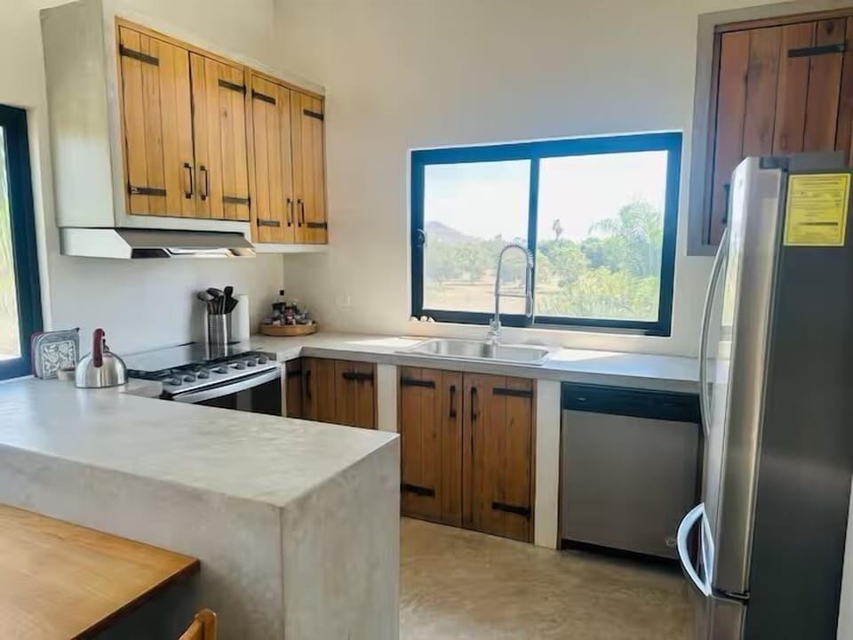 Fully stocked kitchen with oven/stove and dishwasher. 