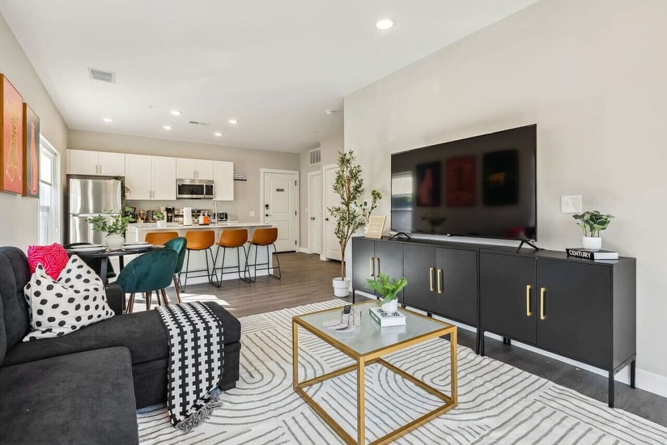 You feel a sense of peace as you step into the living room , with its inviting decor and soothing tones.