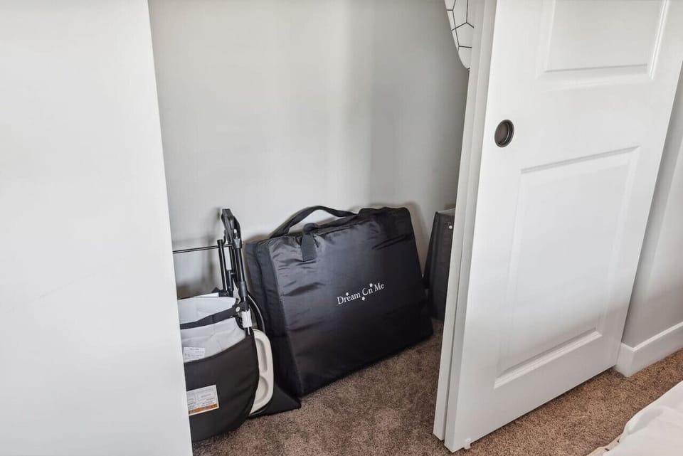 Sleek closet doors hide plenty of storage space, ensuring your room remains open and tidy during your stay.