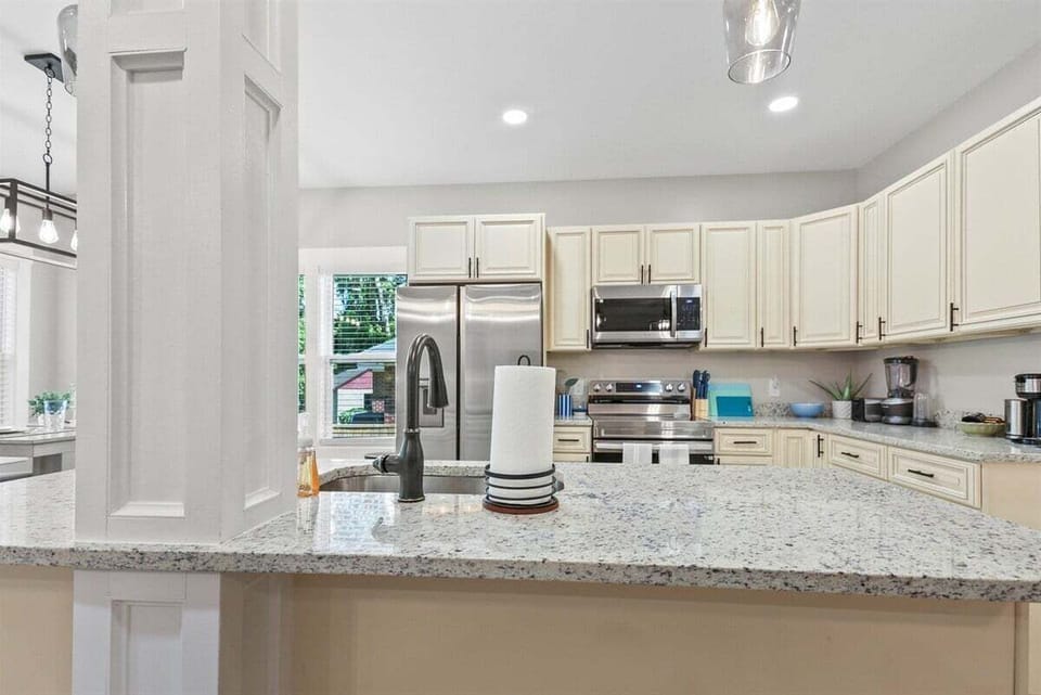 From sofa to stovetop, stay connected in this open, inviting layout.