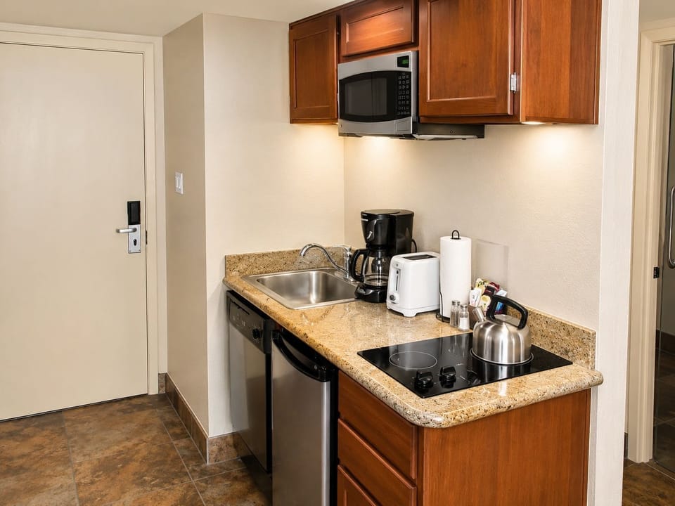 Enjoy the convenience of modern amenities in your cozy kitchen space, complete with everything you need to feel at home while you embark on your desert getaway.