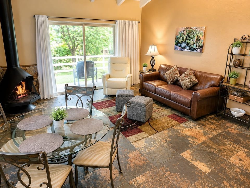 Enjoy intimate family gatherings in a spacious living area complete with a gas fireplace and a dining space, ideal for creating lasting memories.