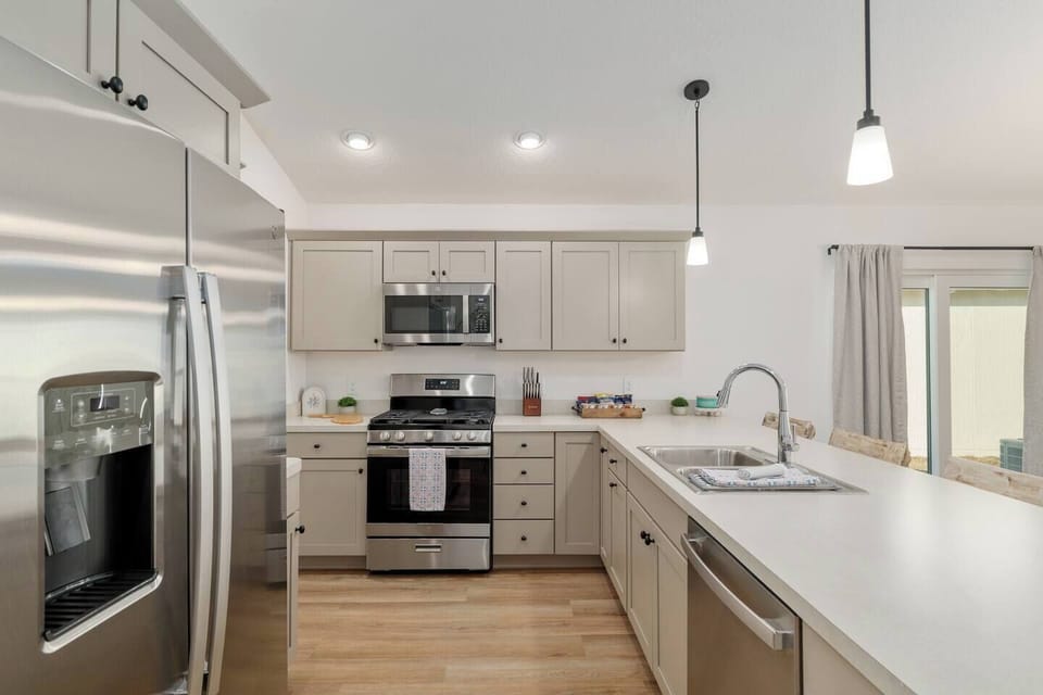 Plenty of counter space and open to the living room so that your whole group can gather and make memories.