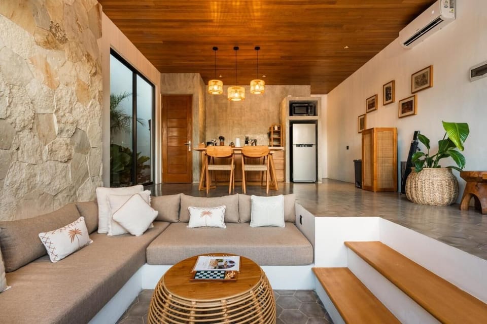 Enclosed living area with AC, smart TV, and sofa – Villa Levante
