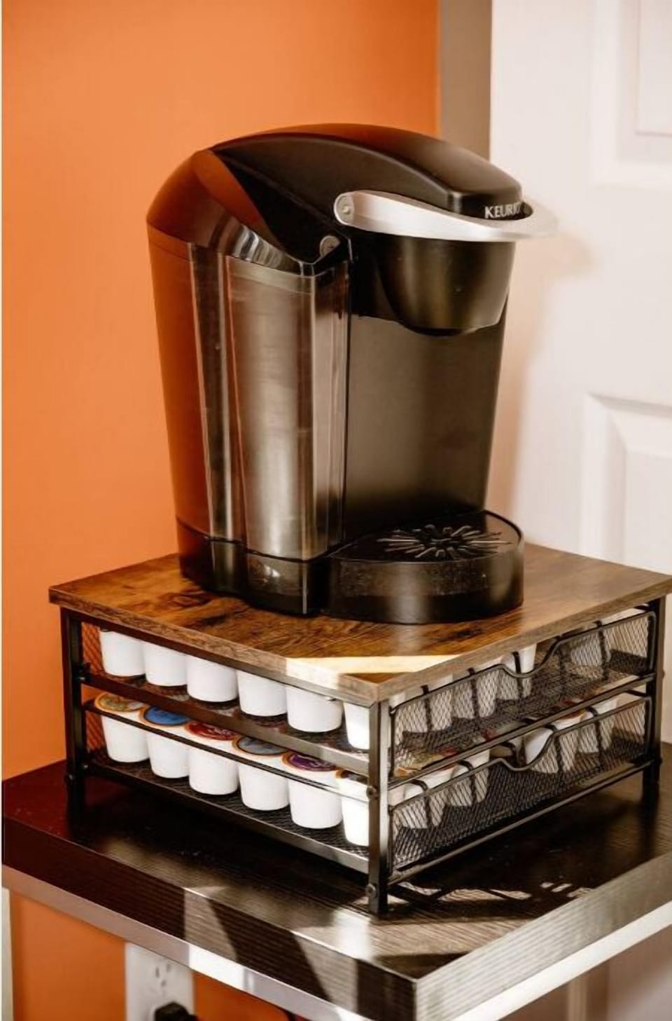 Keurig coffee maker and a large variety of beverage pods