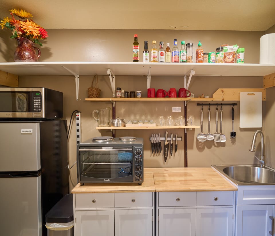 Microwave, refrigerator with freezer, and convection oven with stovetop