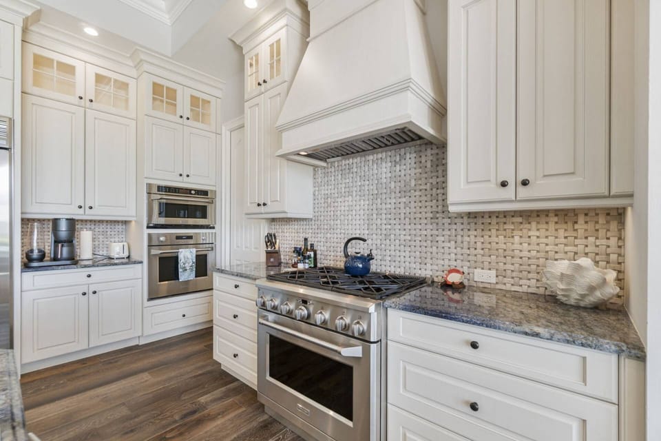 A chef's kitchen with gas stove.
