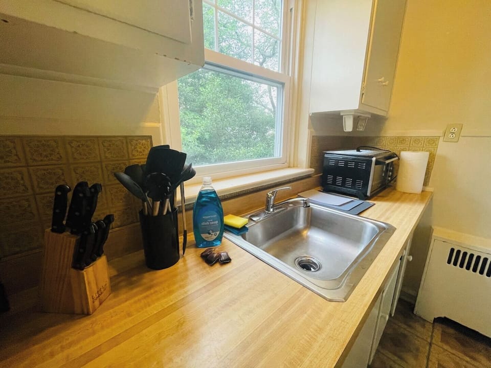 Step into a well-appointed kitchen designed for convenience. It includes a full-sized refrigerator, range, and plenty of counter space for meal prep. You'll find generous storage in the cabinetry, making it easy to keep things organized.
